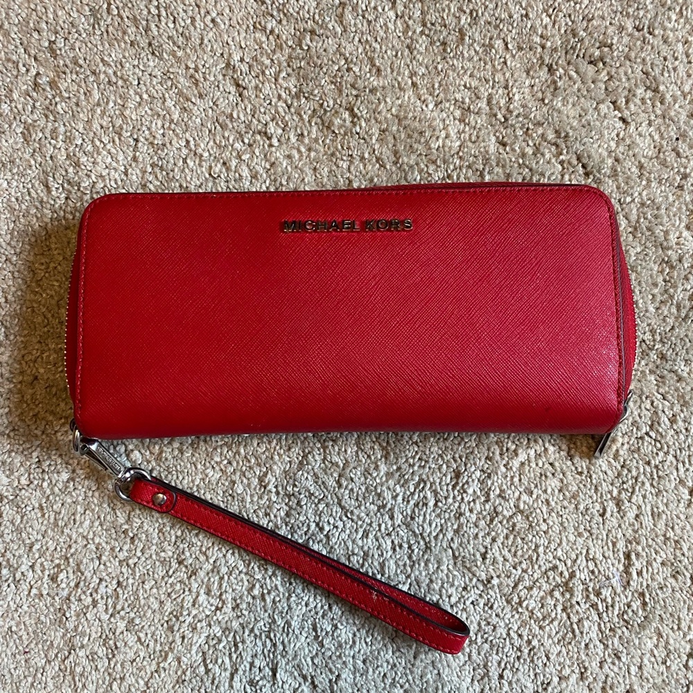 Large red Michael Kors zip wallet wristlet